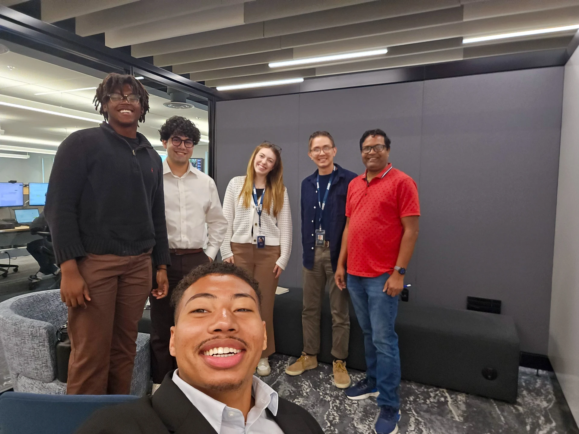 Adrian with his BNY colleagues in the office.